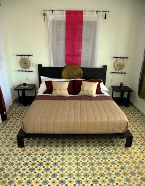 arabic bedroom decor with white and pink flowera and floor tyles in a traditional Moroccan style