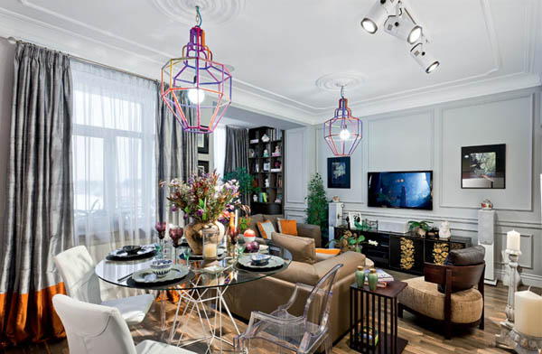 interior decorating in eclectic style with unique lighting fixtures and french paintings