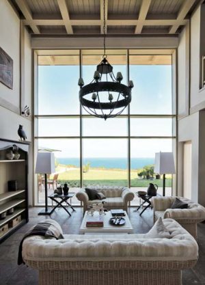 white living room furniture and antique chandelier