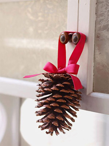 pine cone with red ribbon