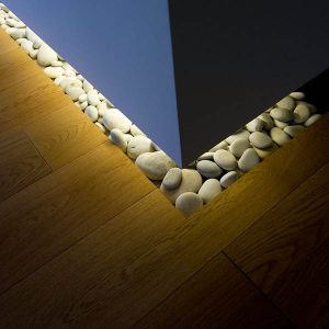 beach pebbles on wood floor