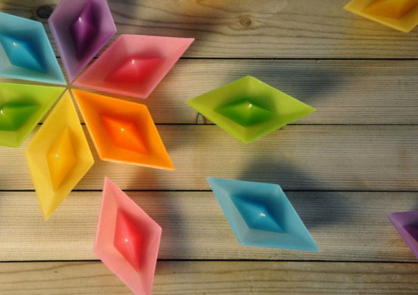 colorful candles in paper boat shapes