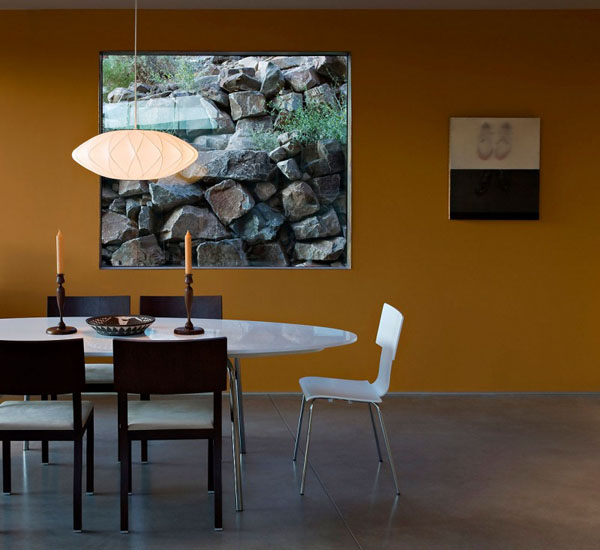 contemporary dining room with yellow wall and window