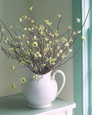 table centerpiece made of flowering branches