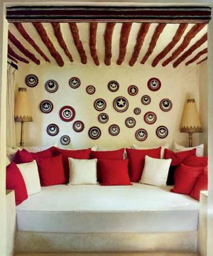 sofa with decorative pillows in white and red colors