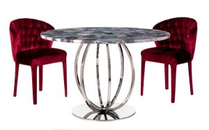 round table and two upholstered chairs in red color