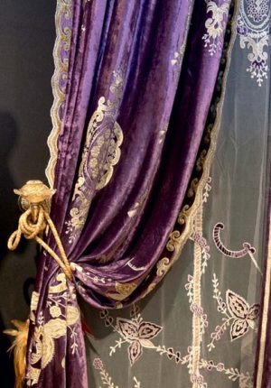 purple draperies with golden and embroidered details