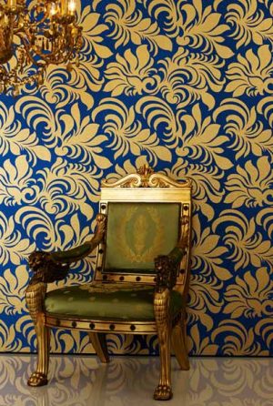 blue wallpaper with golden floral designs