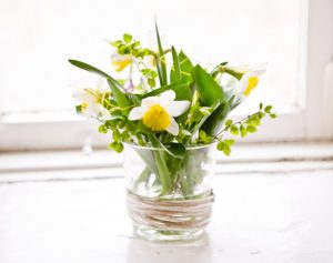 floral arrangement in glass vase for table decoration