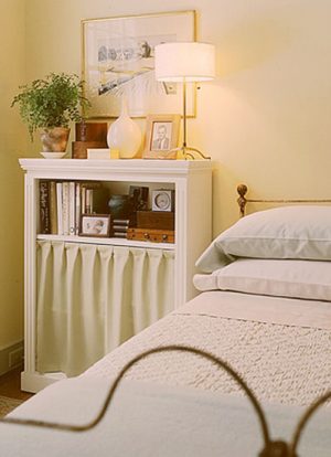 bedside cabinet in white color with curtain