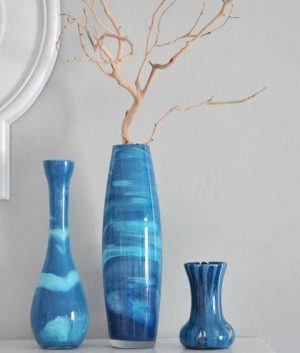blue decorative vases with dry branches