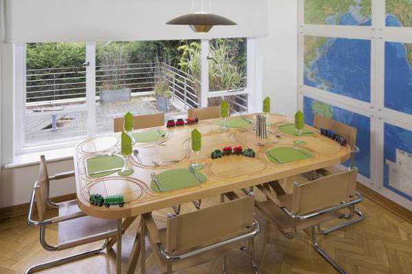 dining furniture with trains transporting food around table