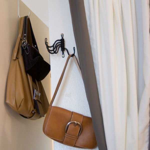 wall hooks and curtains for storing handbags