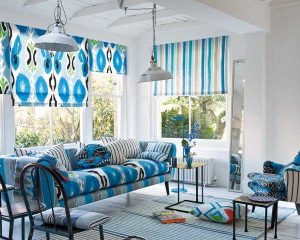 blue window shades and sofa upholstery fabric with ikat pattern and stripes