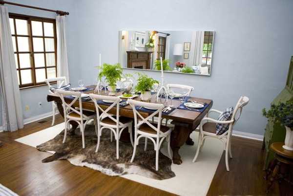 solid wood dining table and white chairs