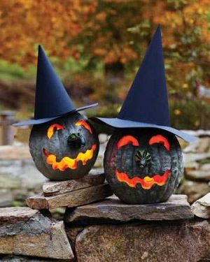 black pumpkins in witch hats