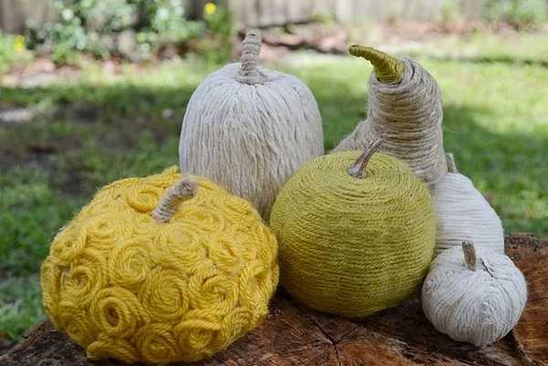 green white and yellow pumpkins made of yarn