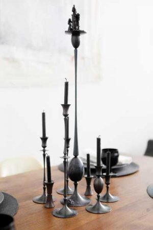 black candles and candle holders