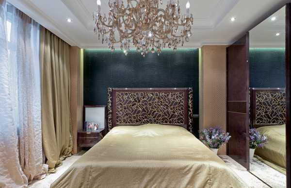 master bedroom decorating with large chandelier and unique bed headboard