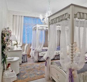 kids bedroom decorating with two four post beds in white