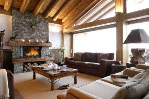 stone fireplace and wood ceiling design