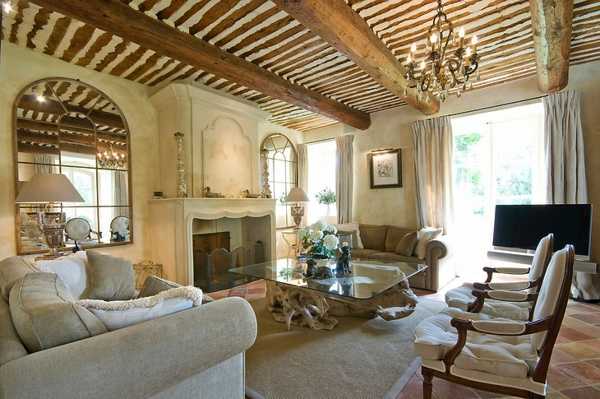 wood ceiling beams and vintage lamps for living room design in country home style