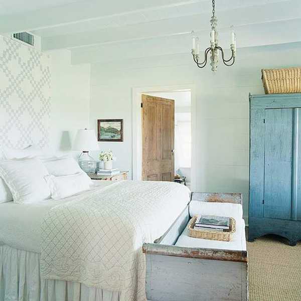 white bedding and blue bedroom furniture in country home style