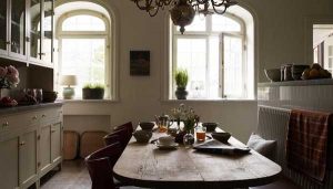 wood dining table and brass chandelier for dining room decorating in vintage style