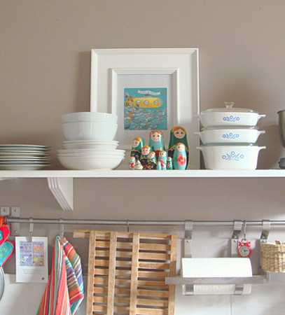 white kitchen cabinet with shelves fir dishes