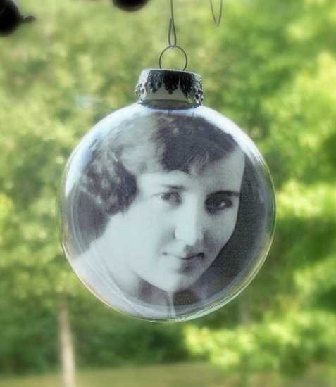 glass christmas tree decorations with black and white photographs