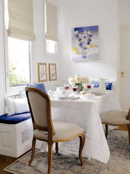 dining room decorating with white window seat bench and cushions in white and blue colors