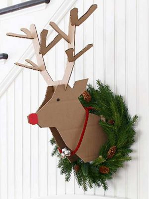 cardboard deer wall decoration with green christmas wreath