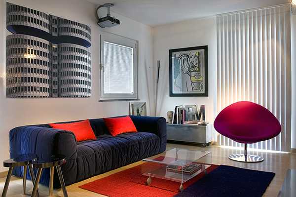 living room design with artworks and red accents