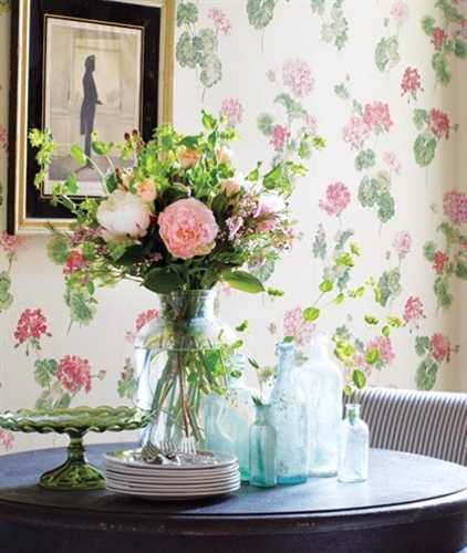 floral wallpaper and antique glass vases with flowers