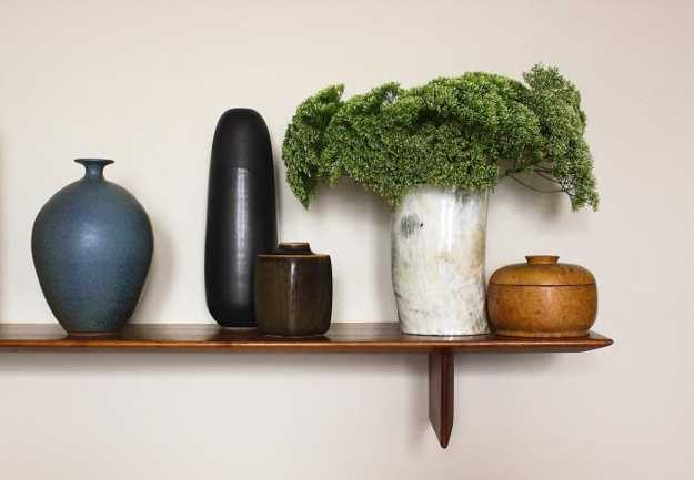 ceramic and wooden decorative vases in neutral color shades
