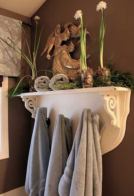 fresh flower arrangement in bathroom shelf