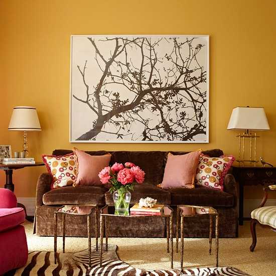 living room with tree painting on wall