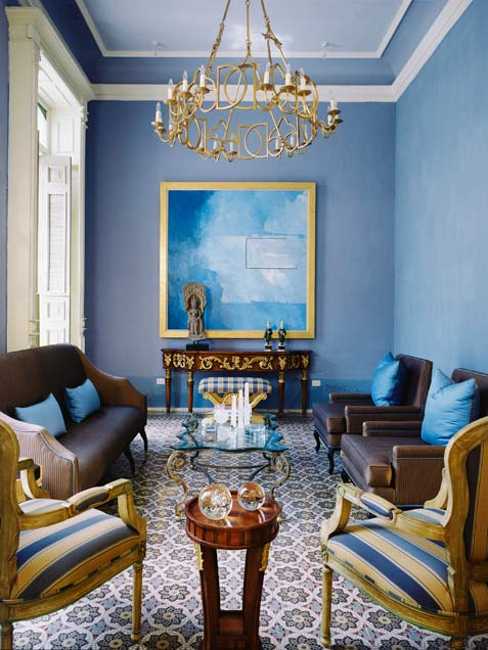 blue wall paint and decorative pillows