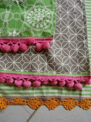 dishtowels decorated with pompons