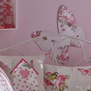 pink wall paint and white home fabrics with pink flowers, butterflies decorations for wall