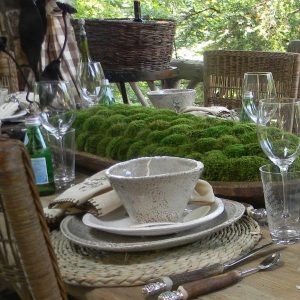 ceramic tableware and green moss centerpiece idea