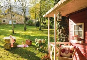 cottage with stone walls and outdoor living spaces