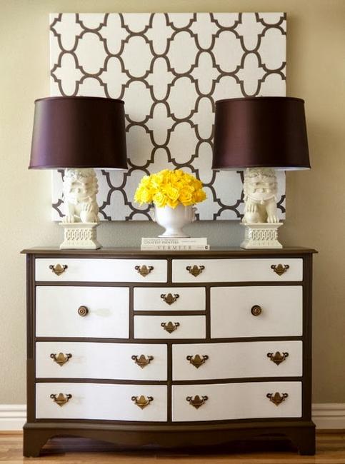 A Decorative Throw Pillow On A Bedroom Chest