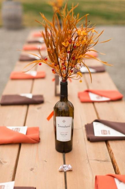 fall decorating picnic table with branches