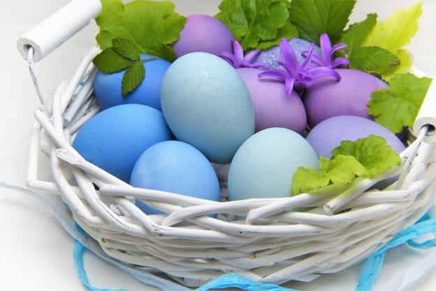 white painted basket colorful eggs