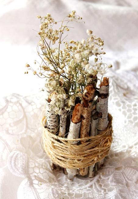 birch logs blooming branches table centerpiece